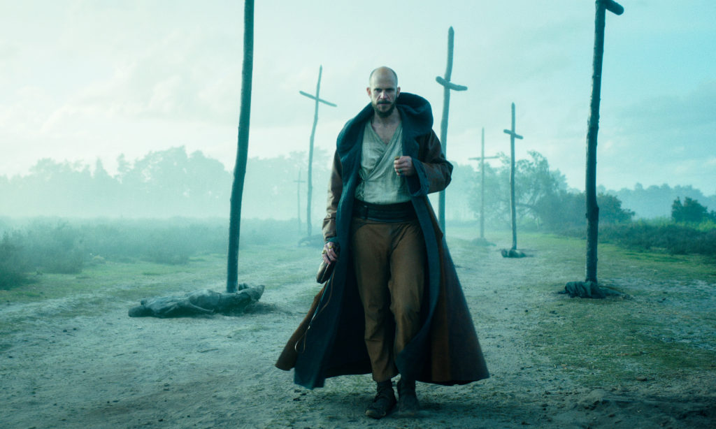 Interview with Zetna Fuentes, Executive Producer for Netflix's Cursed GUSTAF SKARSGARD as MERLIN in episode 102 of CURSED Cr. COURTESY OF NETFLIX © 2020